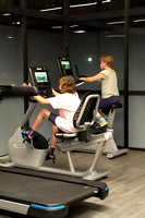 The girls playing on hotel exercise machines