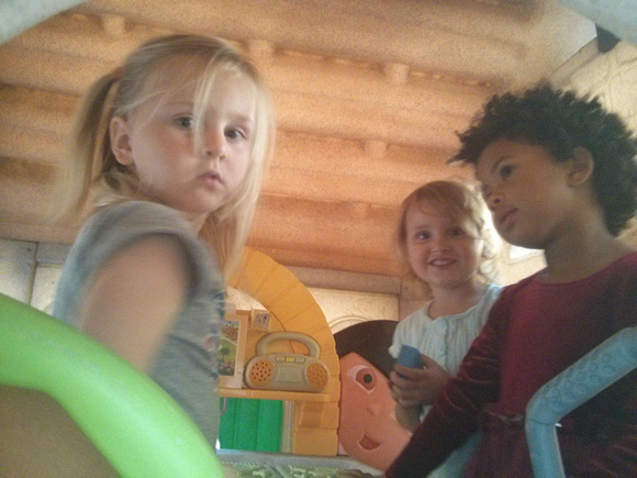 Several children in the play house.