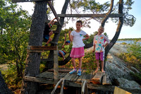 Cousins playing in the treehouse