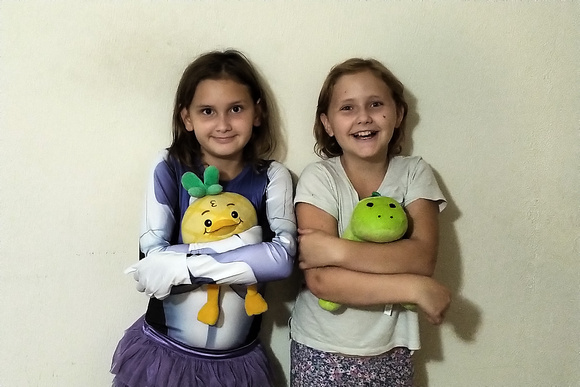 Girls posing with stuffies