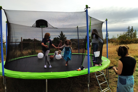 Playing on a trampoline at a party