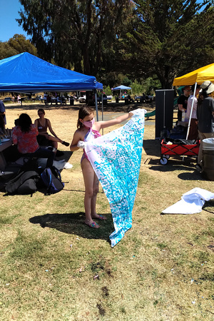 K making flags at Rationalist Summer Solstice