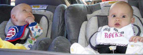 Babies as seen from the back of the minivan.
