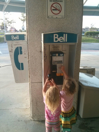 They *loved* this old-school telephone we found in Toronto, Canada #MomTrip2015