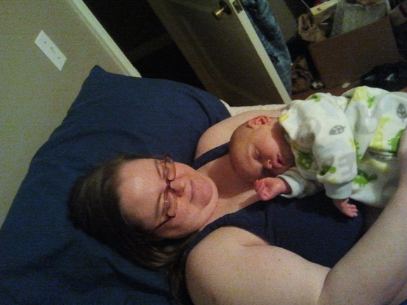 Baby sleeping on Auntie Jen.