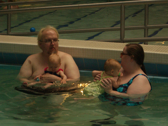 RJ, AJ, and the babies in the pool.