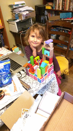 K made a complicated block tower in very little space.
