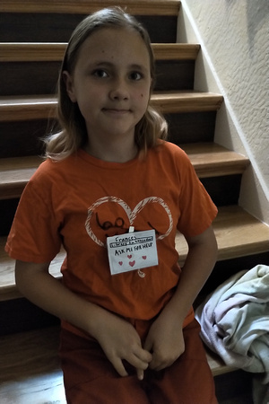 F in her Library Ambassador badge