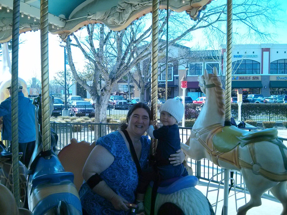 RA and F on the carousel at the new Nut Tree