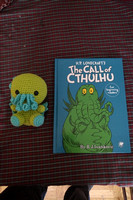 K's baby Cthulhu with her Cthulhu book