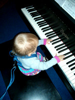 Trying out the piano (at church, I think).