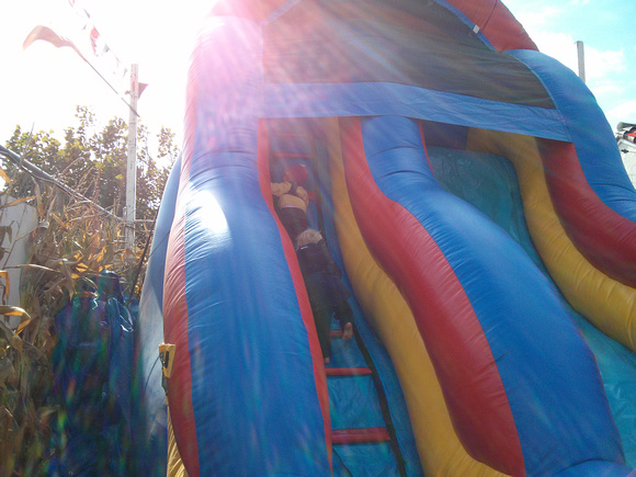 Babies climbing up an inflated slide!