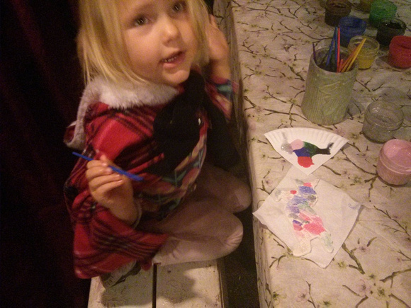 F painting an ornament at Dicken's Fair