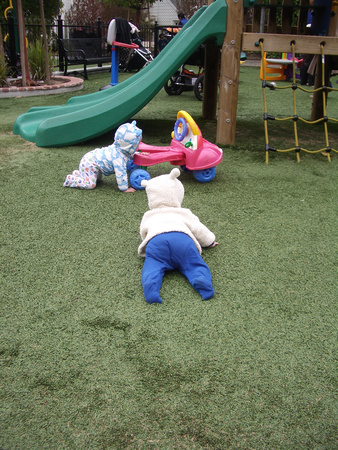 Babies exploring at the park.