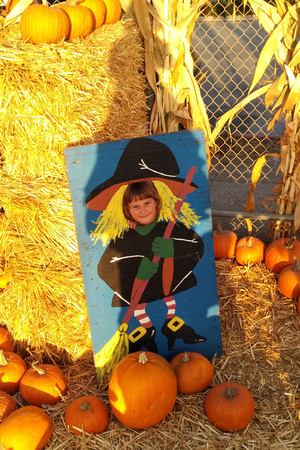 K as a witch at the pumpkin patch