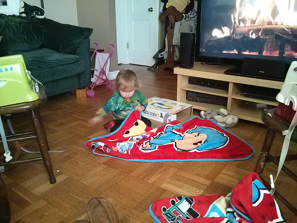 K putting the Peppa Pig family (an xmas present) to sleep with her giant Pocoyo blanket (also an xmas present)  (Christmas 2013)