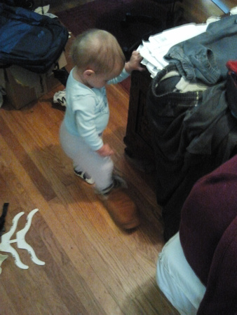 Trying out daddy's shoes.