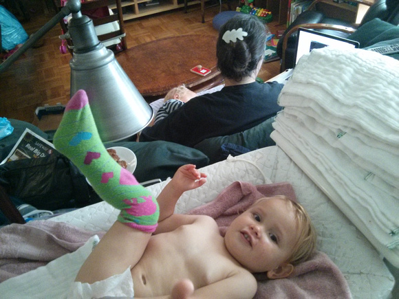 K wearing mommy's sock.