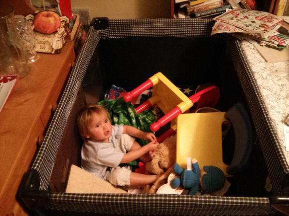 K wanted to play in the storage container/crib; I think she actually *climbed in* on her own.