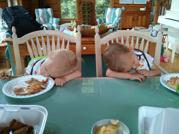 Babies asleep in their food.