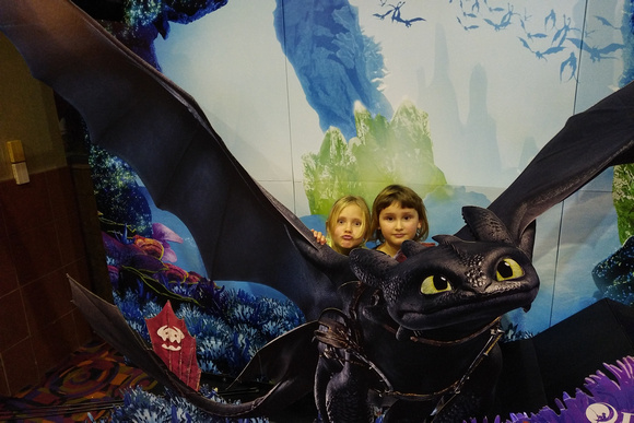 Behind poster for How to train your dragon in movie theater