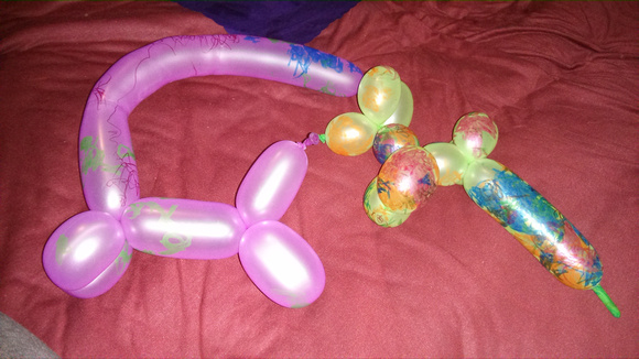 The girls had fun drawing on baloons.