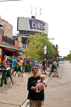 Baby and RA with the cubs sign in the background.