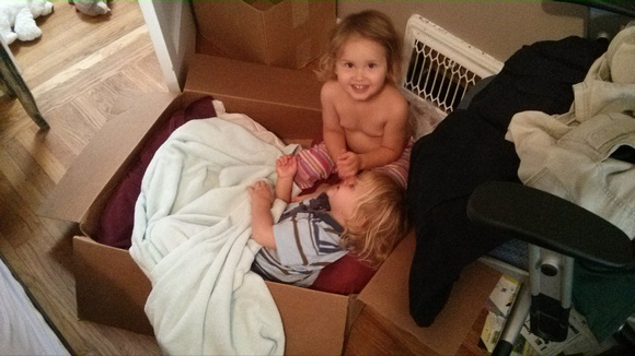 The girls made a bed out of a box in my room.