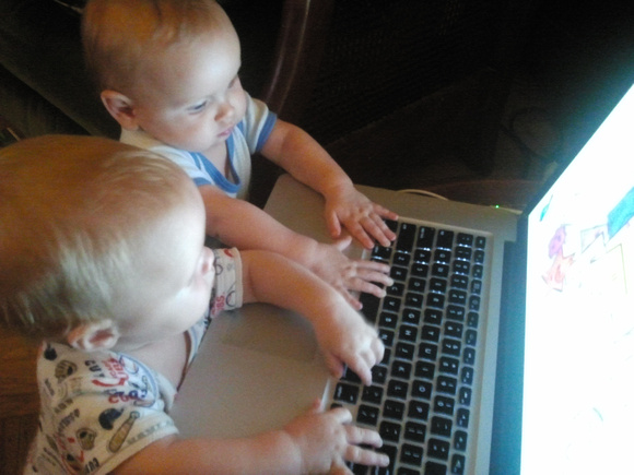Babies playing with BabySmash!, a "game" for babies.