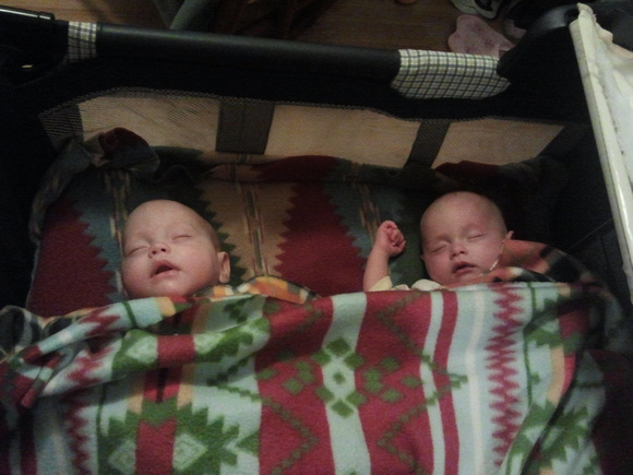 *Both* babies *sleeping* in the crib at the same time; very rare.